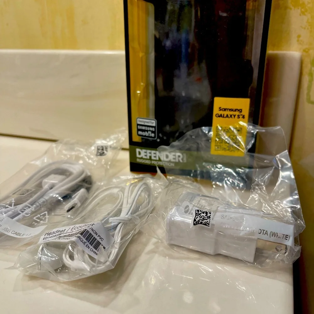 Samsung Galaxy S4 Otter Box, charger, earbuds.NEW